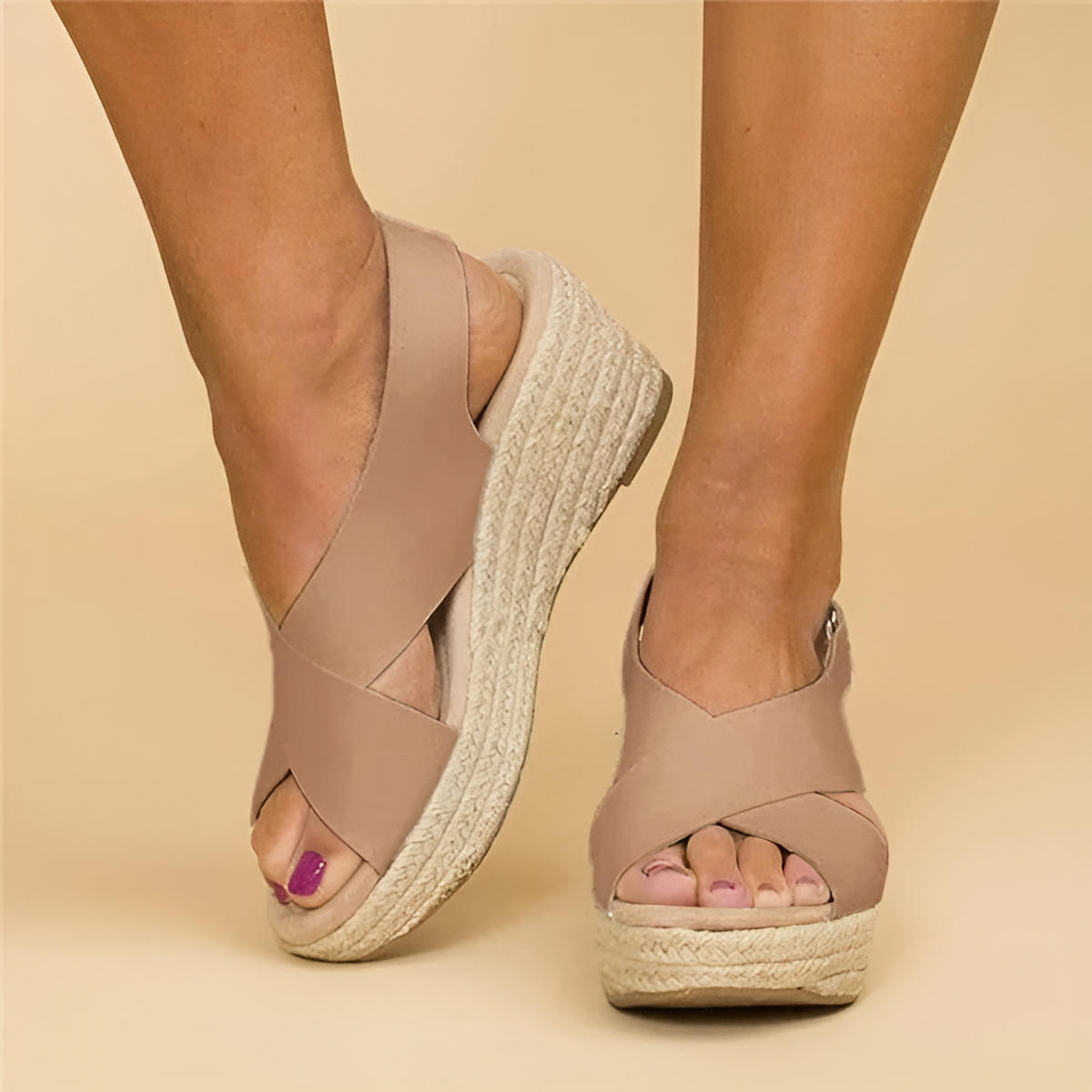 Beige textured espadrille wedge sandals with criss-cross straps and natural fiber sole