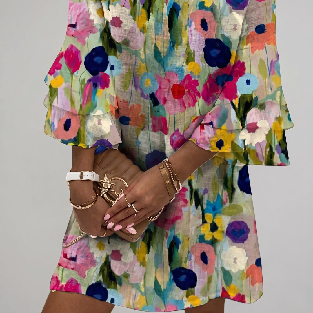Close-up of watercolor floral print on linen blend mini dress fabric