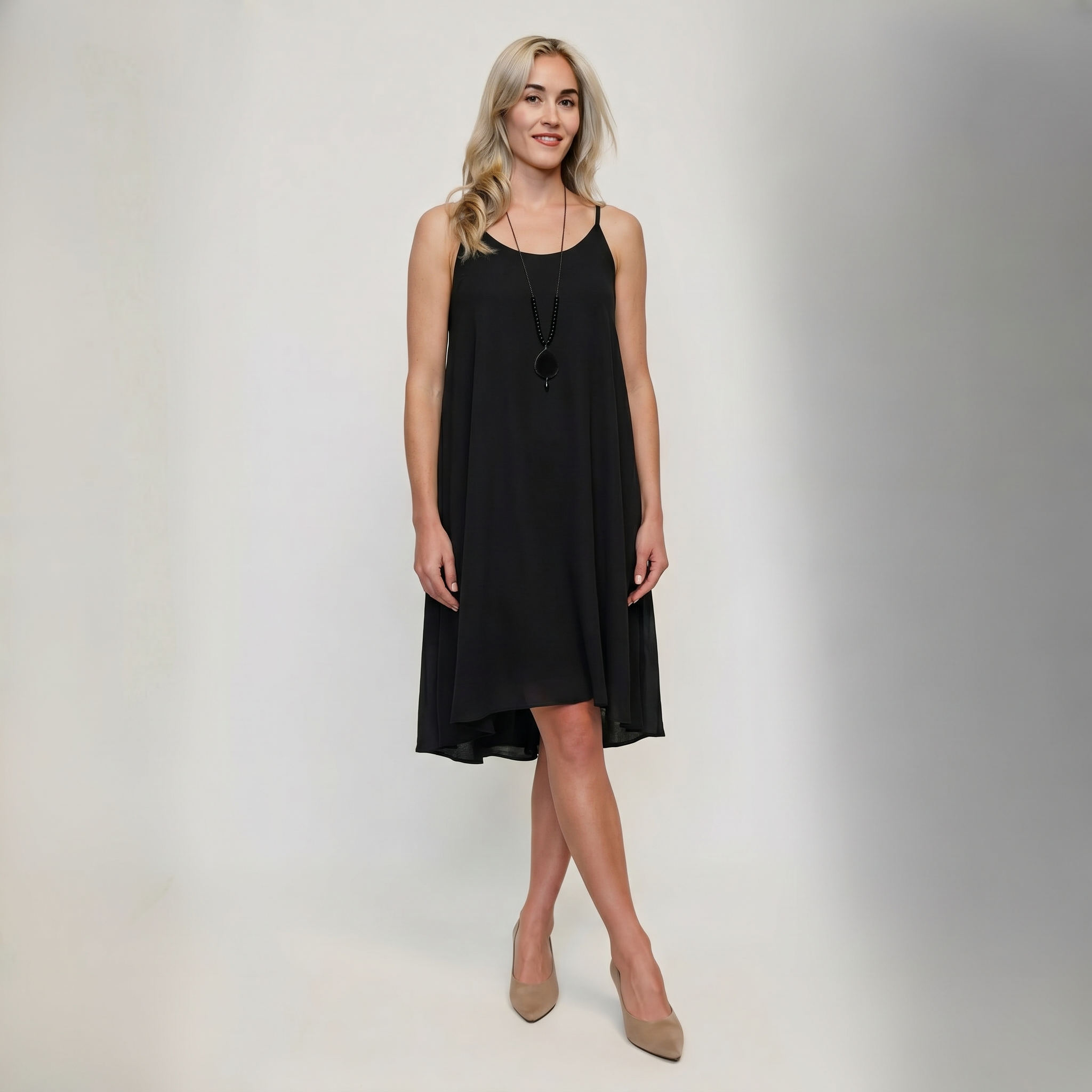Women's fuchsia sleeveless flared mini dress in lightweight chiffon with high-low hem