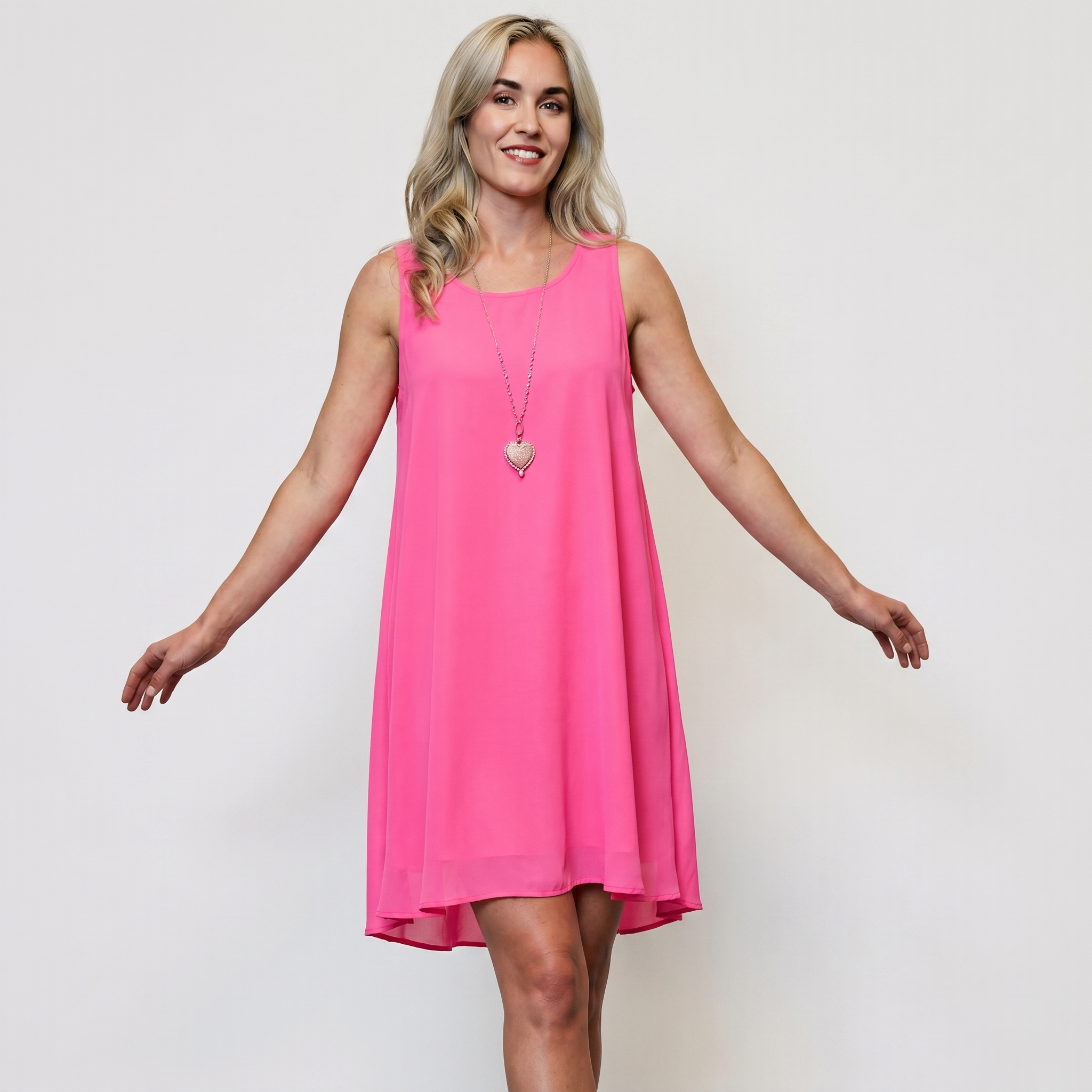 Women's fuchsia sleeveless flared mini dress in lightweight chiffon with high-low hem