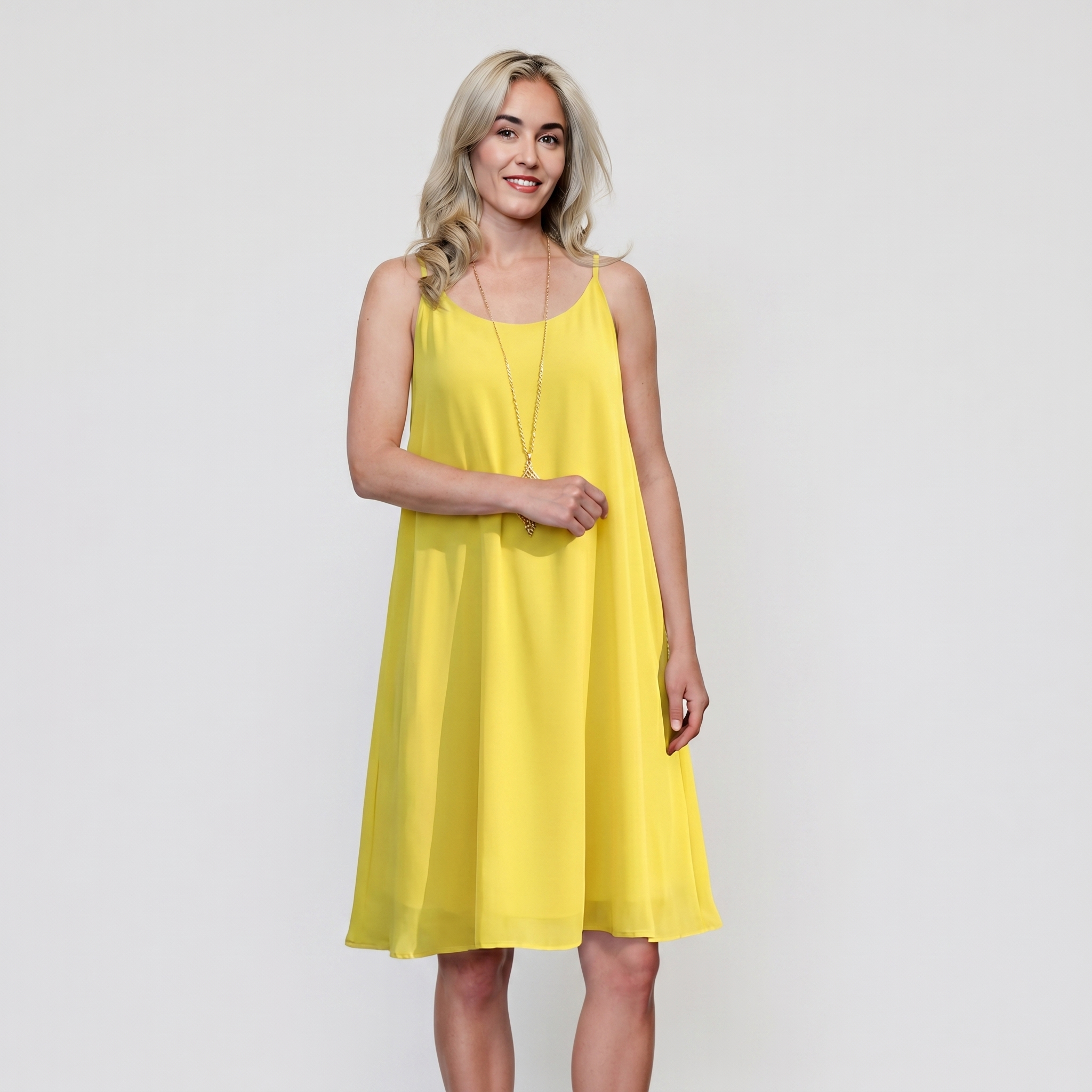 Women's fuchsia sleeveless flared mini dress in lightweight chiffon with high-low hem