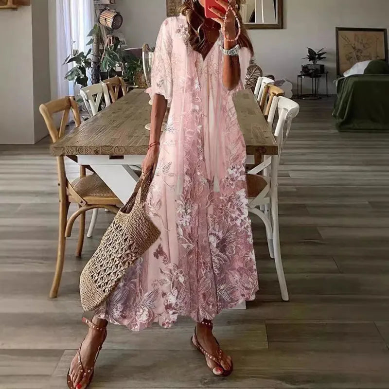 Pink bohemian floral maxi dress with V-neck and tassel tie