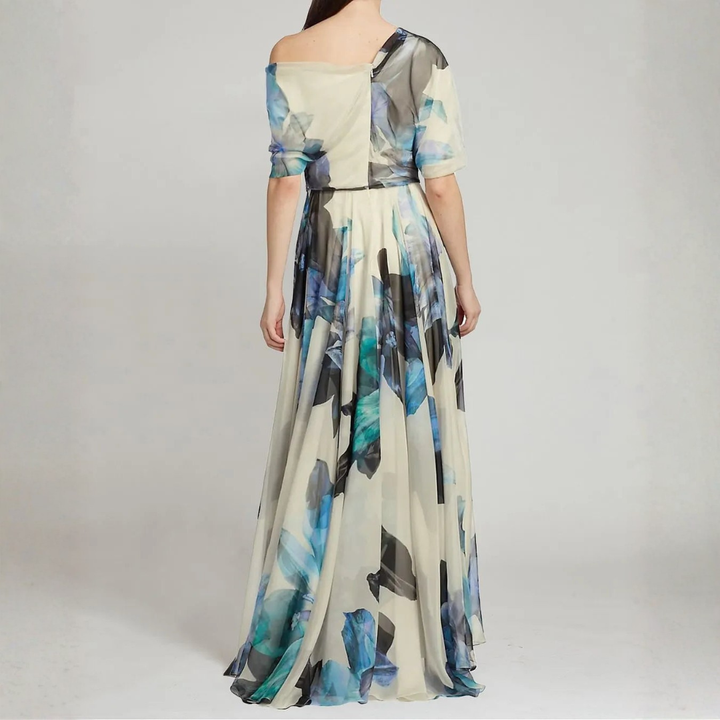 Back view of blue and teal abstract print one shoulder maxi dress