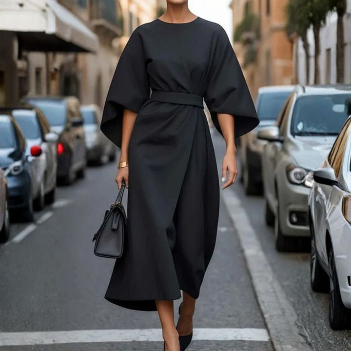 Black batwing sleeve midi dress with belted waist and draped asymmetrical front