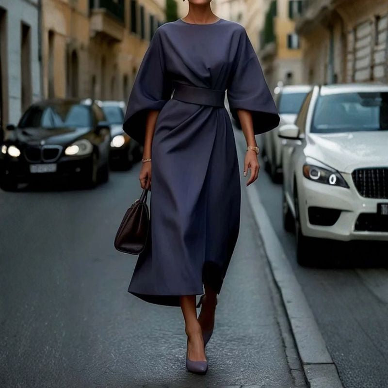 Navy blue batwing sleeve midi dress with draped front panel and tailored waist