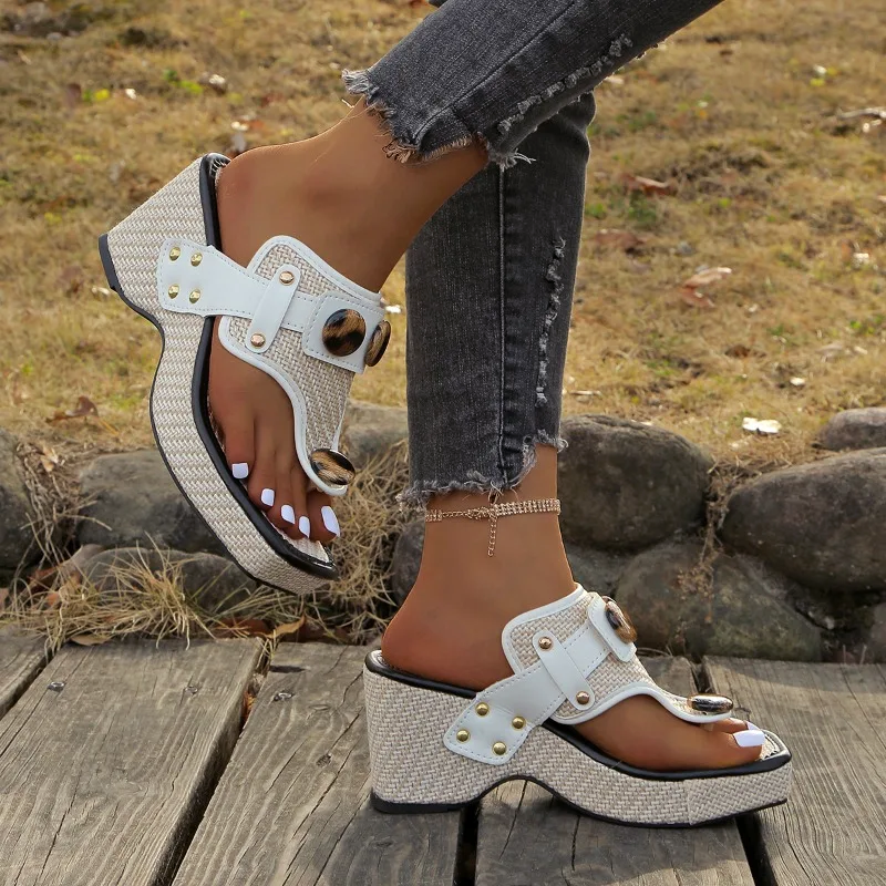 Side view of chunky heel wedge sandals with woven beige upper