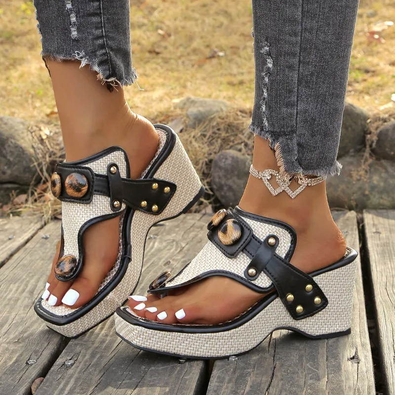 Beige woven platform sandals with tortoiseshell buckles and gold studs