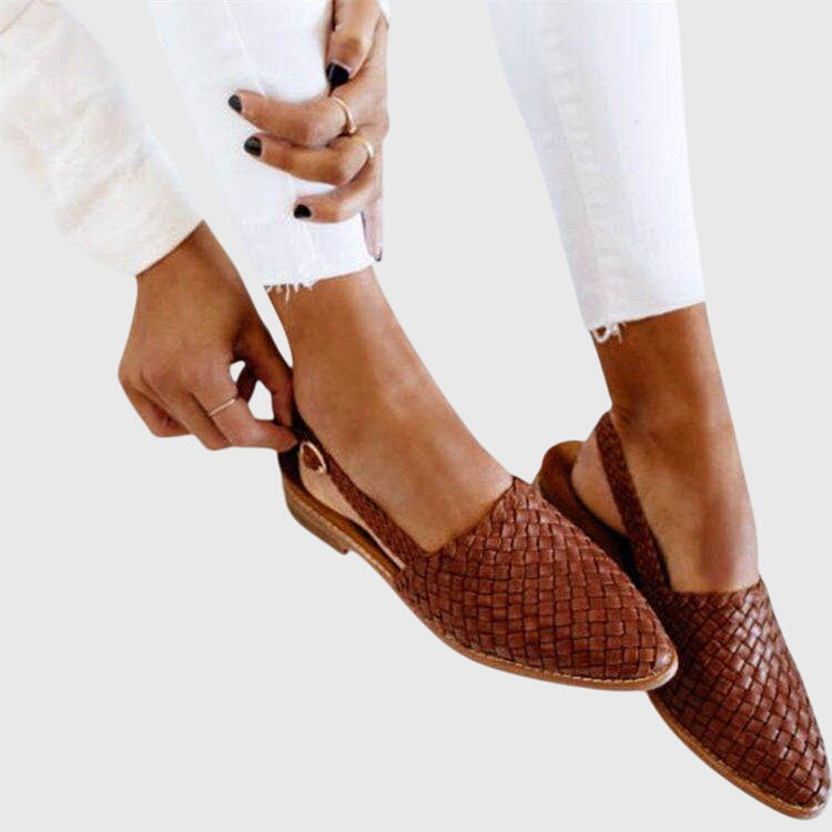 Brown woven orthopedic sandals with slingback straps showing adjustable fit detail