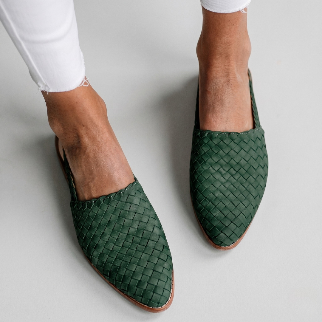 Forest green woven orthopedic mules featuring pointed toe and basket-weave upper