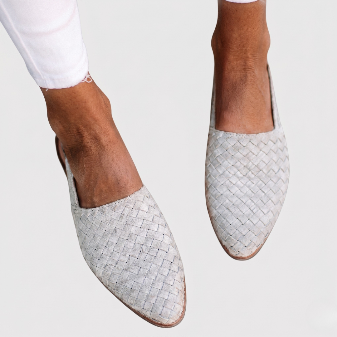 Off-white woven orthopedic sandals featuring tight basket-weave pattern and pointed toe