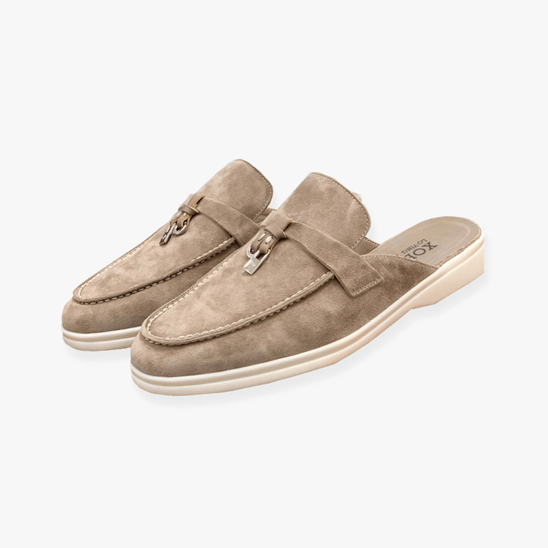Taupe backless suede loafers with silver hardware and thick off-white comfort sole