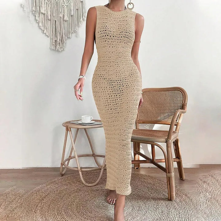 Side profile of beige sleeveless open-knit crochet maxi dress with vertical ribbing