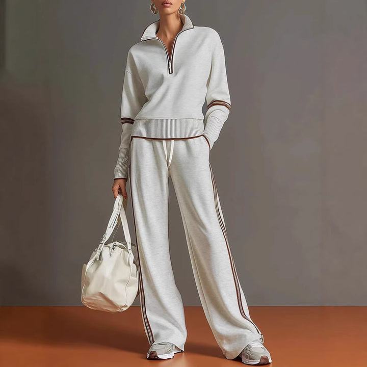 Light heather gray women's knit athleisure set featuring quarter-zip pullover and striped joggers