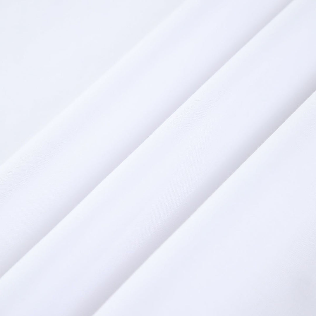 Close-up of smooth lightweight white cotton fabric texture for summer dress