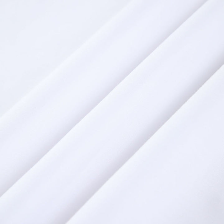 Close-up of smooth lightweight white cotton fabric texture for summer dress