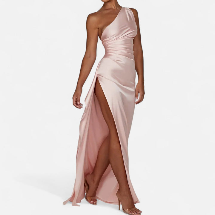 Soft pink one-shoulder satin gown with ruched bodice and high thigh slit