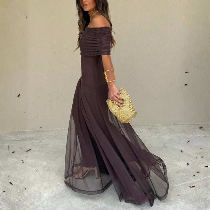 Dark brown off-shoulder maxi dress with fitted bodice and floor-length chiffon layers