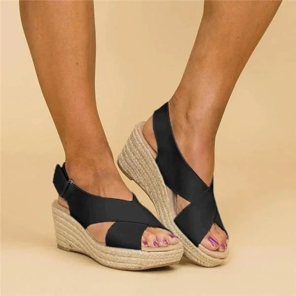 Black leather espadrille wedges with metal buckle ankle strap and thick rope sole