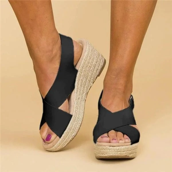Black women's espadrille wedge sandals with adjustable ankle strap and woven platform