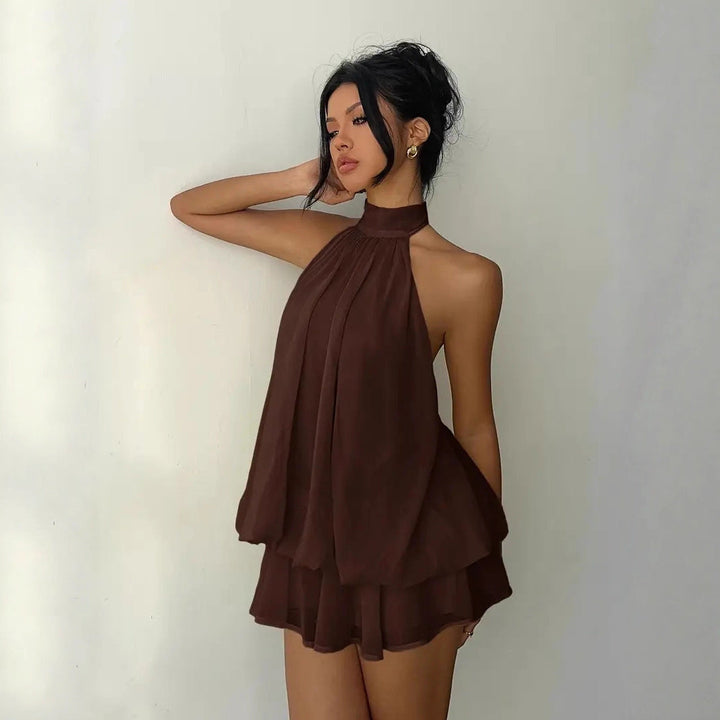 Brown halter neck mini dress with semi-sheer chiffon and open back detail