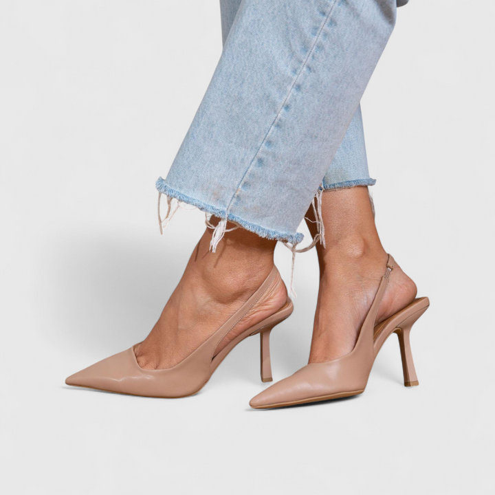 Beige low-shine pointed toe slingback pumps with stiletto heel and synthetic leather