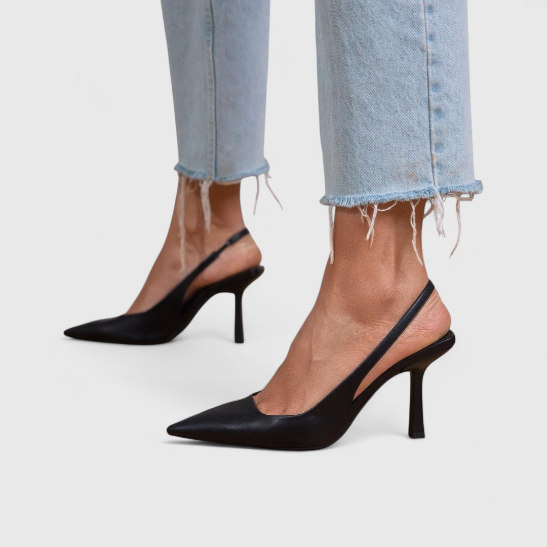 Black pointed toe slingback pumps with stiletto heel and smooth synthetic leather