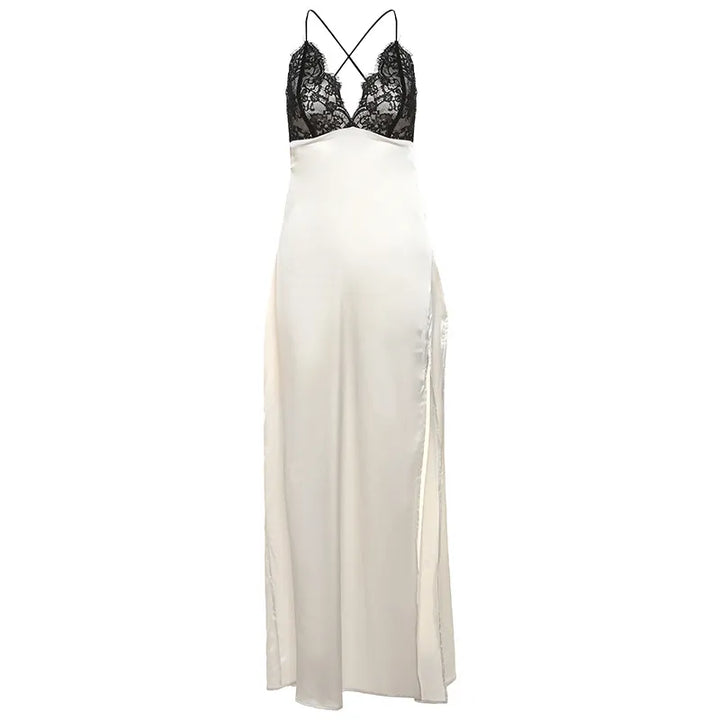 Flat lay of sleeveless champagne satin slip dress with black lace V-neckline