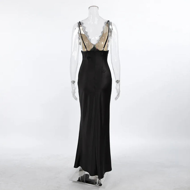 Black satin mermaid silhouette gown with lace-trimmed bust and cross-back straps