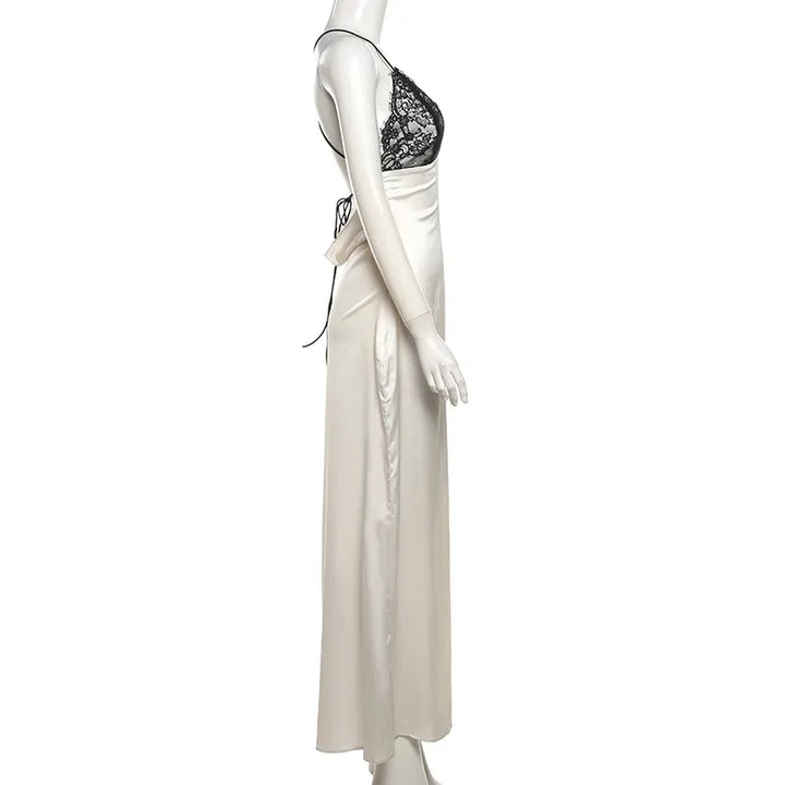 Side view of bias cut champagne satin maxi dress with black lace bodice