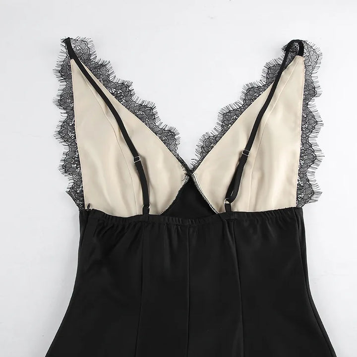 Close-up of adjustable black straps and eyelash lace trim on satin back panel