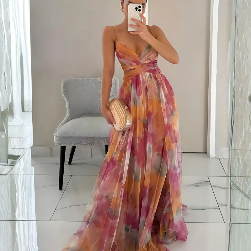 Floral maxi dress with twisted waistband and flowing pleated skirt