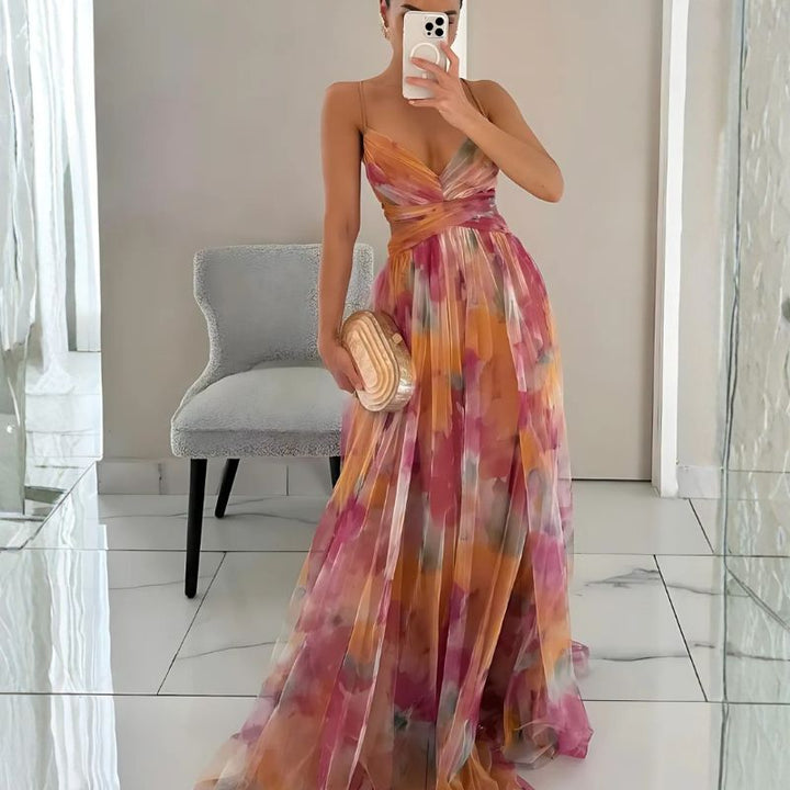 Floral maxi dress with twisted waistband and flowing pleated skirt