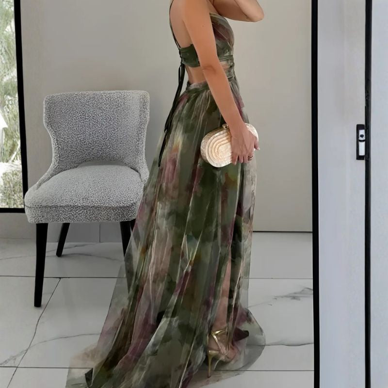 Floral maxi dress with backless design, side slit, and gold heels