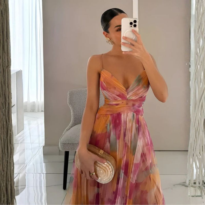 Watercolor floral slip dress featuring deep V-neck and twisted front detail