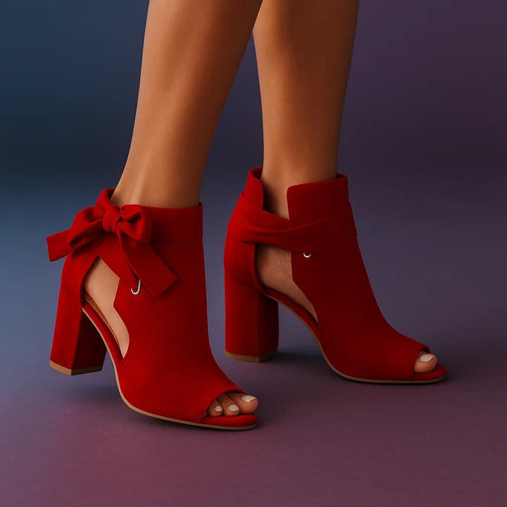 Red peep-toe ankle boots with wide instep strap and cutout detail