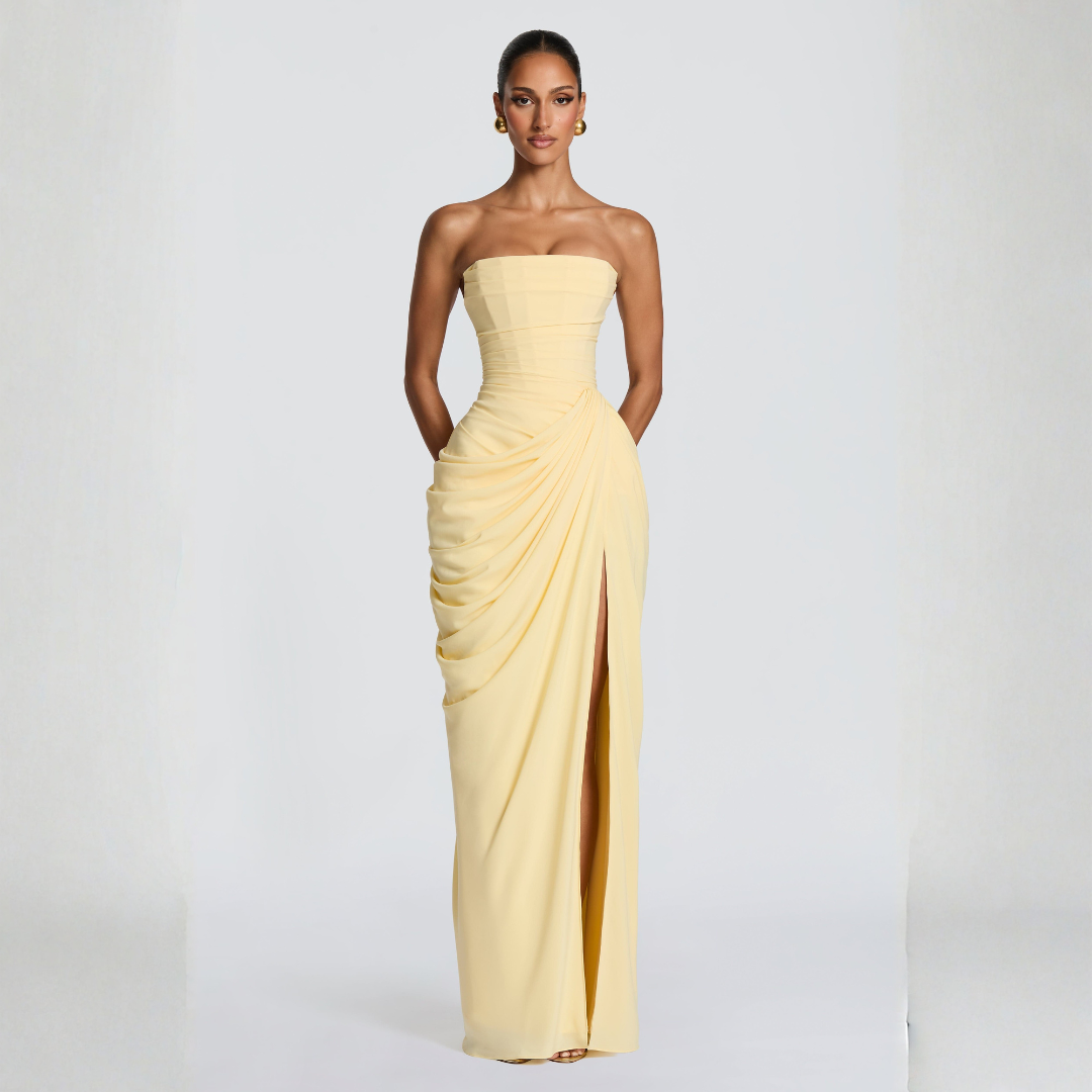 pale yellow strapless corset maxi dress with high thigh slit and draped panel