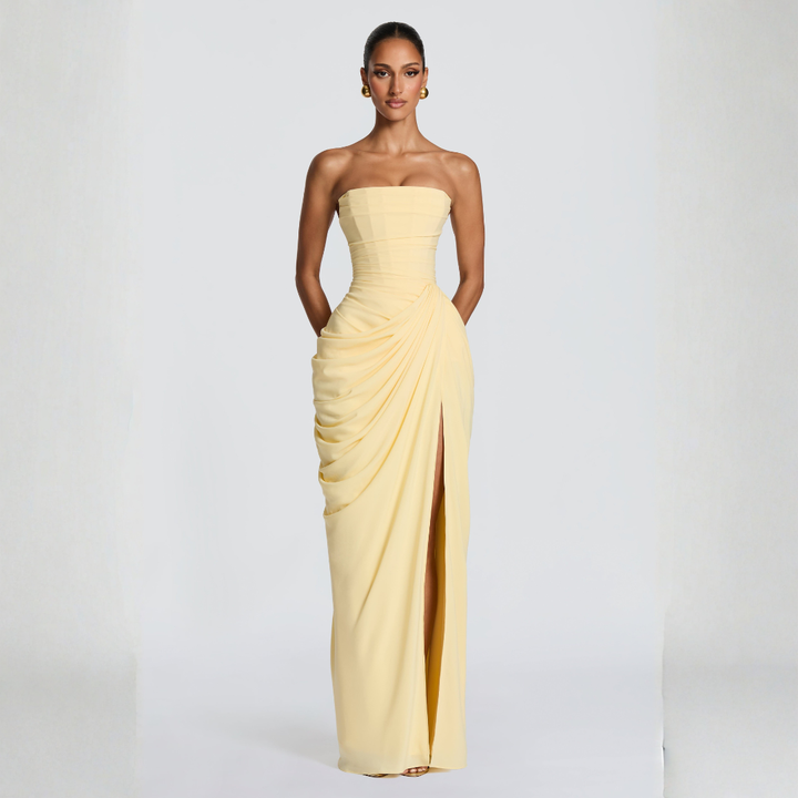 pale yellow strapless corset maxi dress with high thigh slit and draped panel