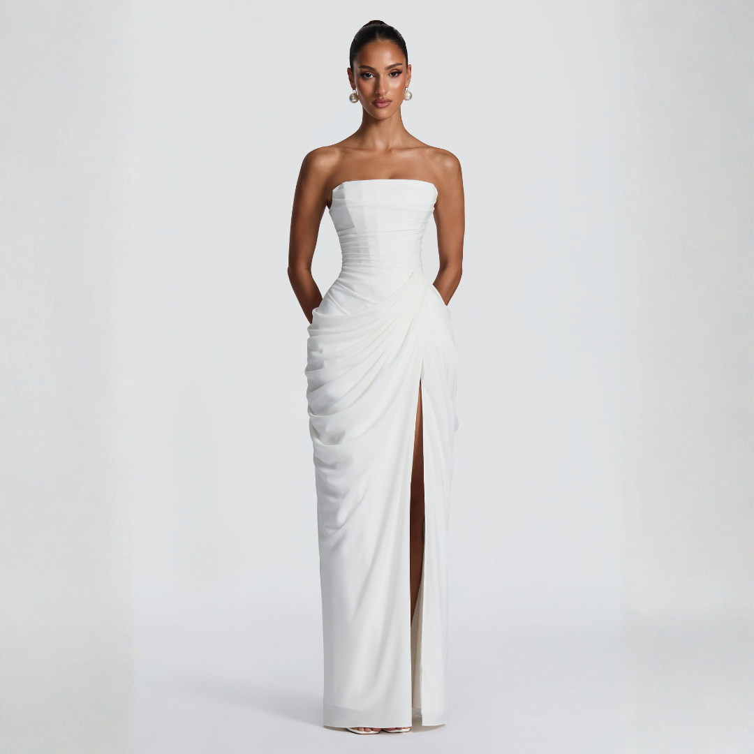 white strapless corset maxi dress with asymmetrical drape and thigh slit