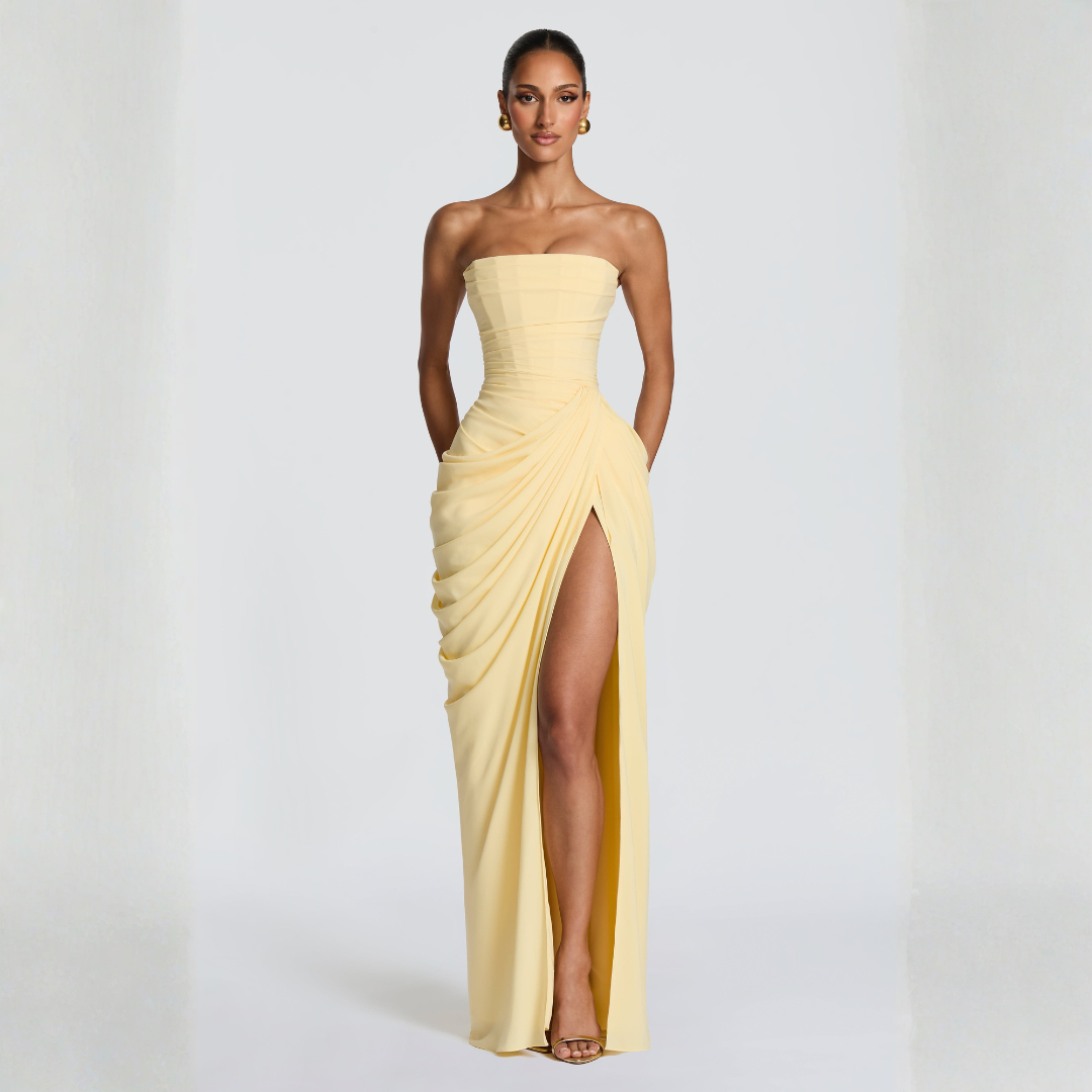 pale yellow strapless maxi dress dynamic pose highlighting high thigh slit