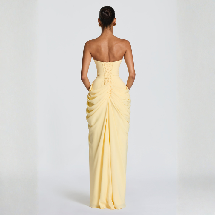 pale yellow back view strapless maxi dress with lace-up corset detailing