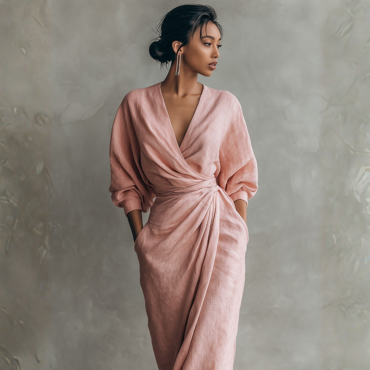 Blush pink linen wrap maxi dress side profile featuring draped panel and twisted waist