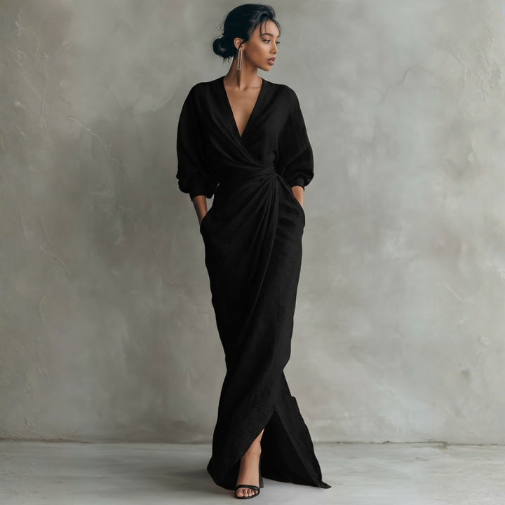 Black linen wrap maxi dress with deep V-neck, puffed sleeves, and high leg slit