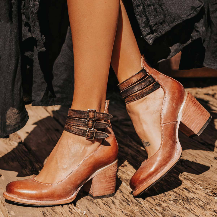 Tan brown leather strappy block heels with visible patina
