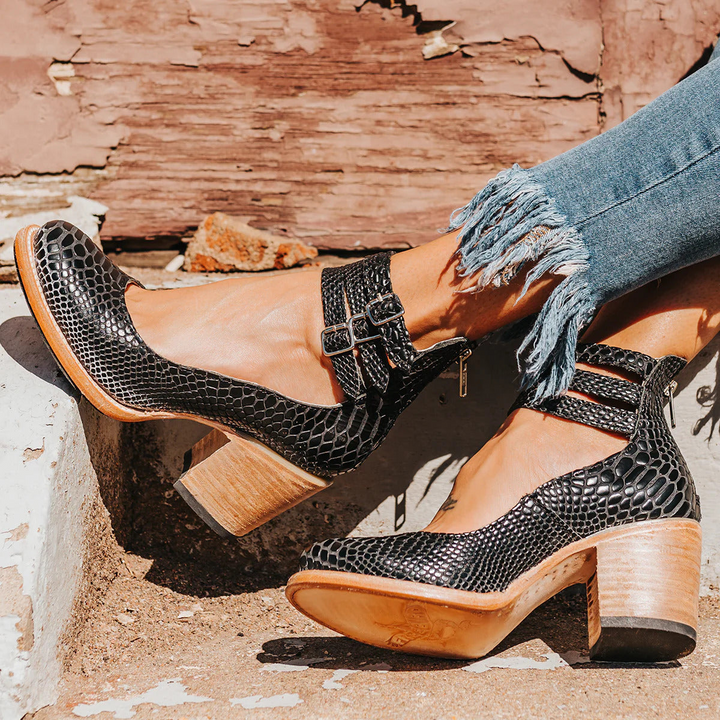 Black snakeskin textured ankle strap block heels with silver buckles