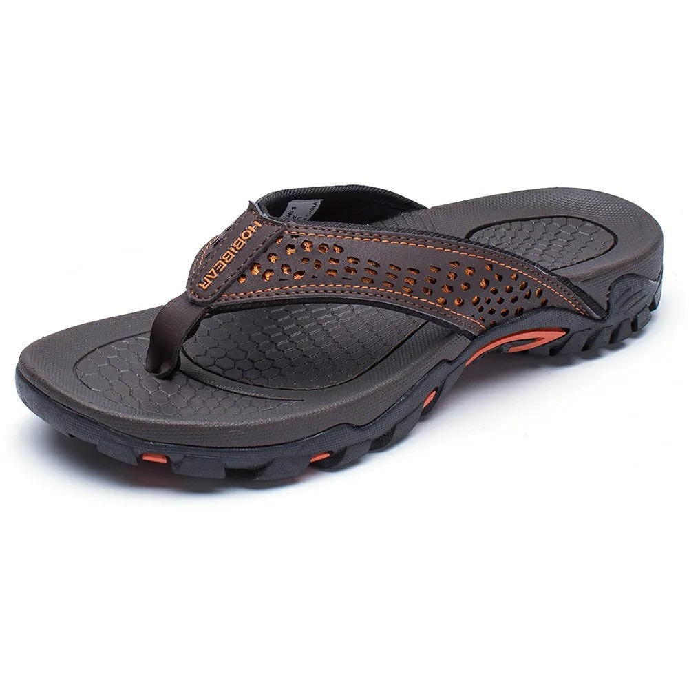 Dark brown MOBIEAR flip flops with orange stitching and traction elements