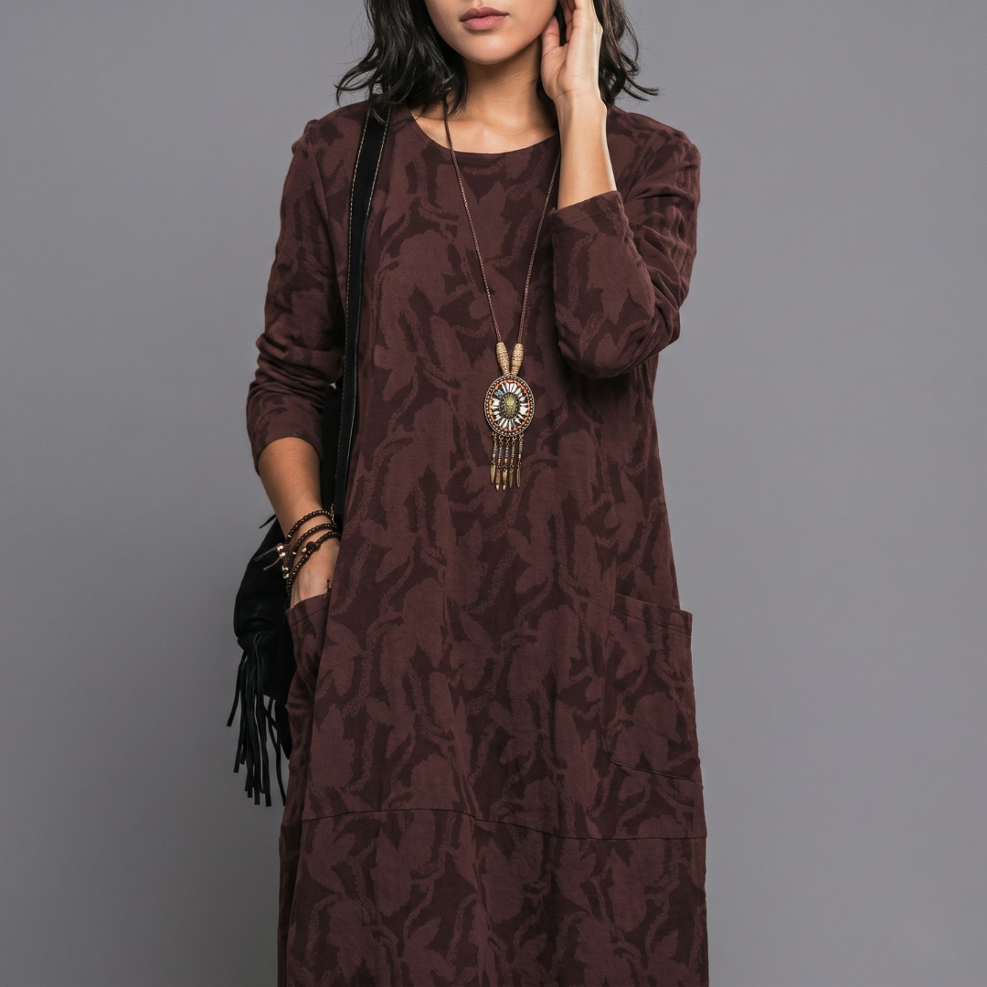 Burgundy printed shift dress with long sleeves and relaxed midi length