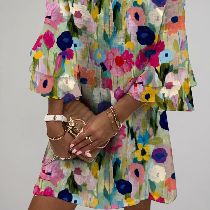 Close-up of watercolor floral print on linen blend mini dress fabric