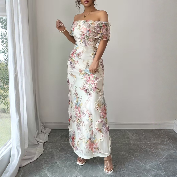 White base floral maxi dress with 3D ruffle embellishments and off-shoulder neckline