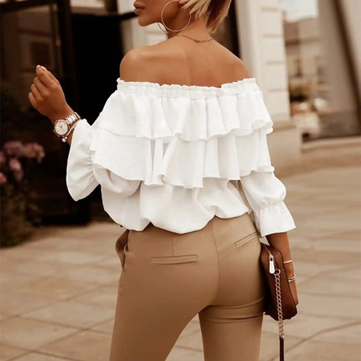 White off-shoulder ruffle blouse with tiered overlays and long sleeves