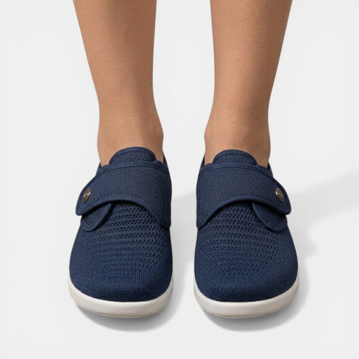 Navy blue breathable knit orthopedic shoe front view with adjustable hook loop strap
